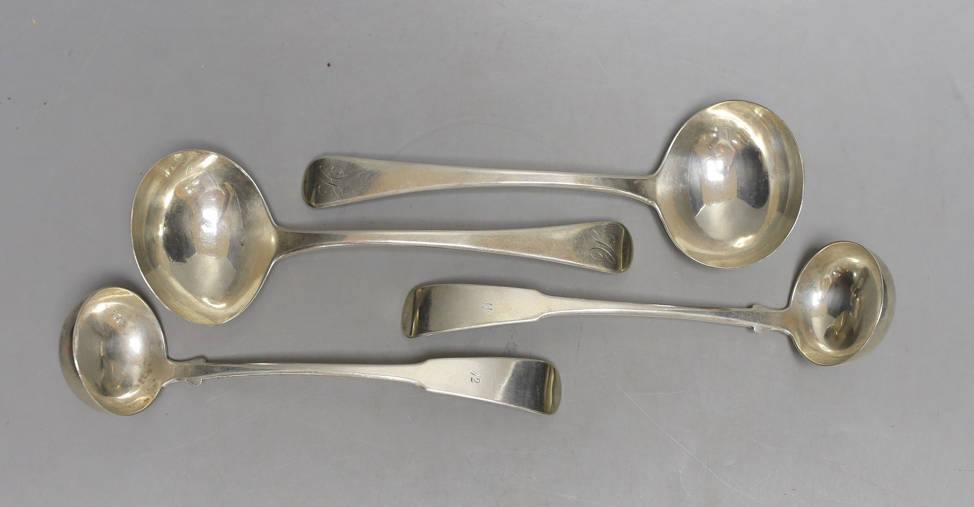 A pair of George IV Scottish silver fiddle pattern sauce ladles, by William Hannay, Glasgow, 1823, 16cm and a pair of George III silver Old English pattern sauce ladles, Eley, Fearn & Chawner, London, 1813, 163 grams